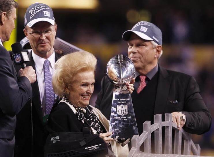 New York Giants owners Steve Tisch and John Mara celebrate their team's win with Mara's mother Ann Mara at the end of the NFL Super Bowl XLVI football game in Indianapolis